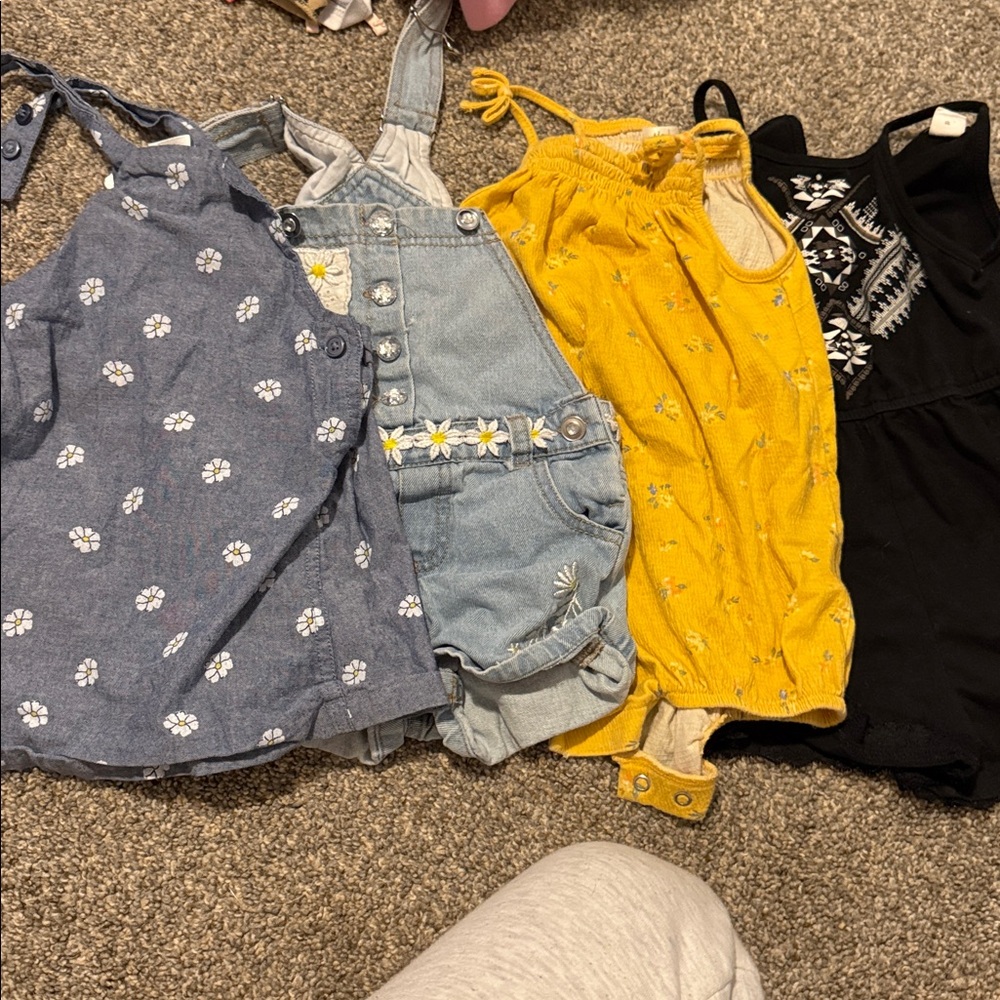 Assorted Baby Rompers in Blue, Yellow, and Black